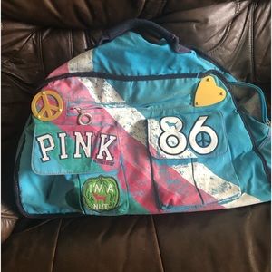 PINK Vintage Rare Victoria’s Secret rolling luggage blue bag.